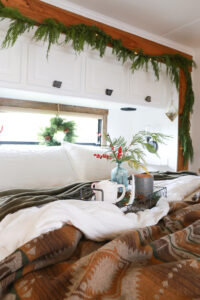 RV bedroom with Christmas garland