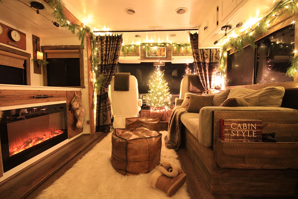 camper with real Christmas tree