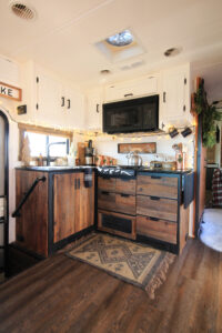 RV kitchen with reclaimed cabinets
