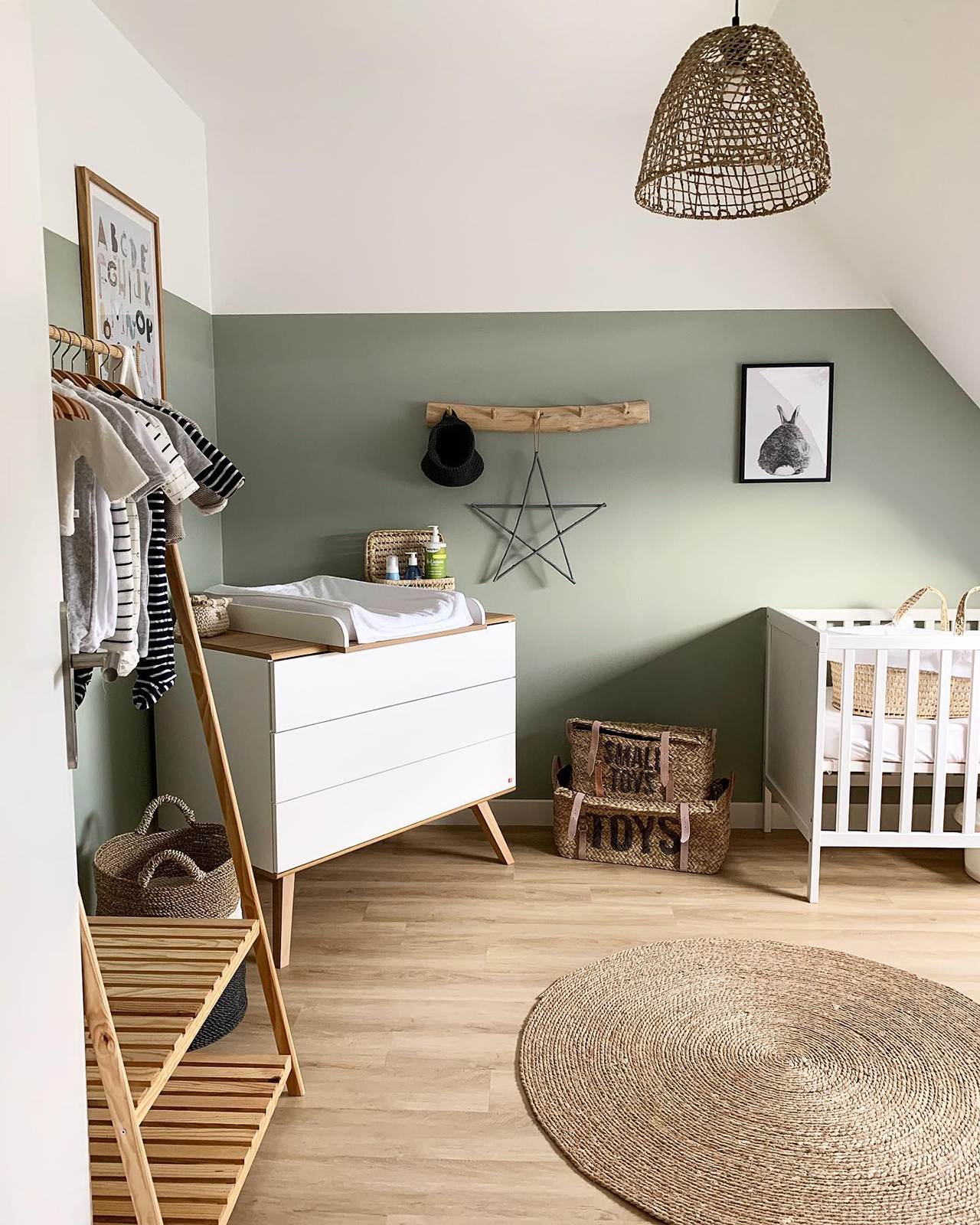 neutral nursery with green accent wall