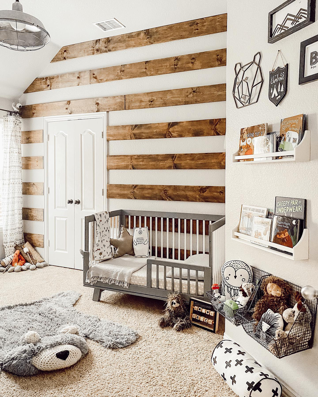 nursery with rustic wood accent wall