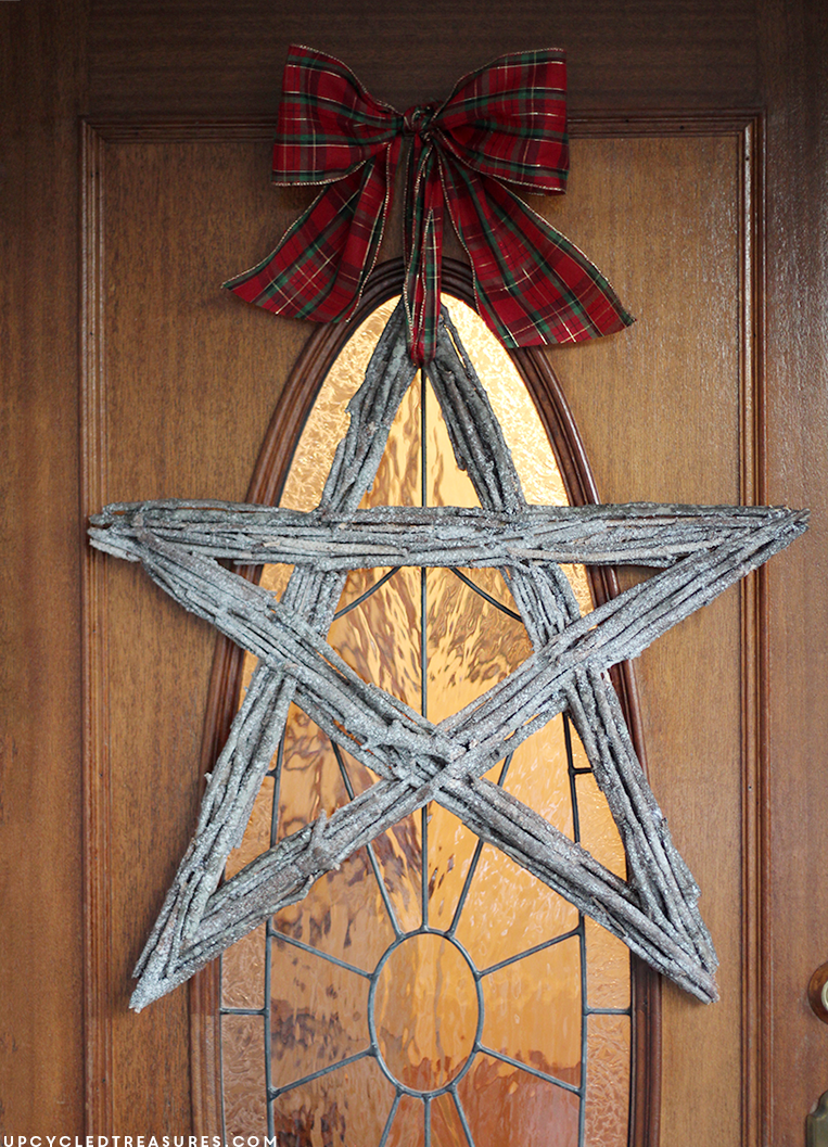 See how easy it was to make this Christmas Twig Star Wreath. The perfect rustic touch to your holiday decor. MountainModernLife.com